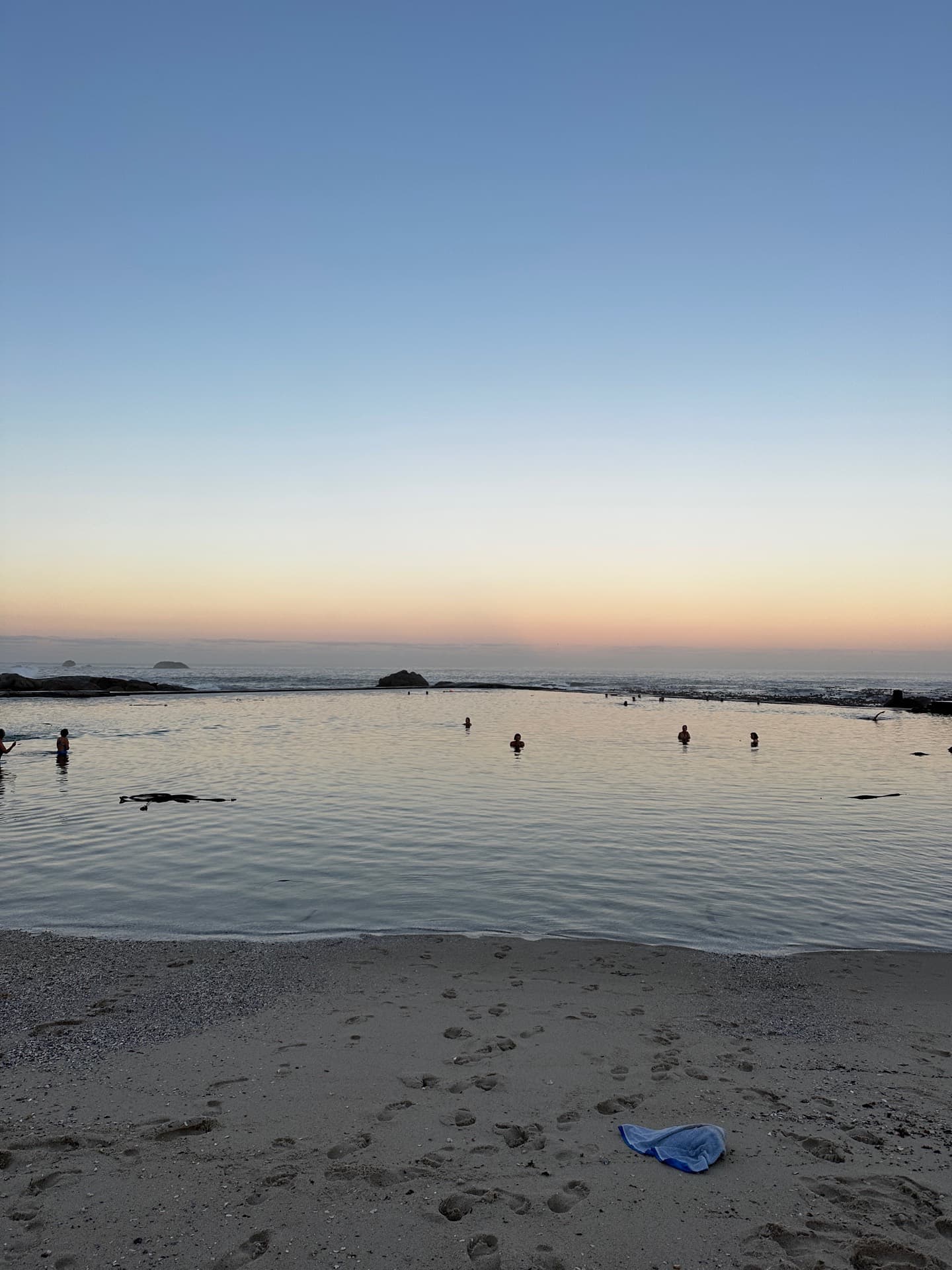 Tidal pool at dusk, a calm moment between seasons