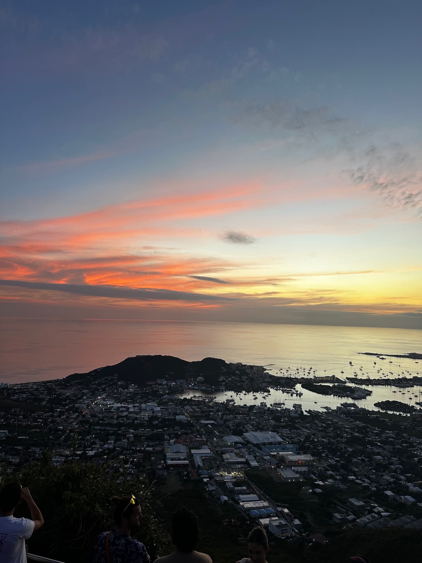 Caribbean harbour at sunset viewed from a hilltop