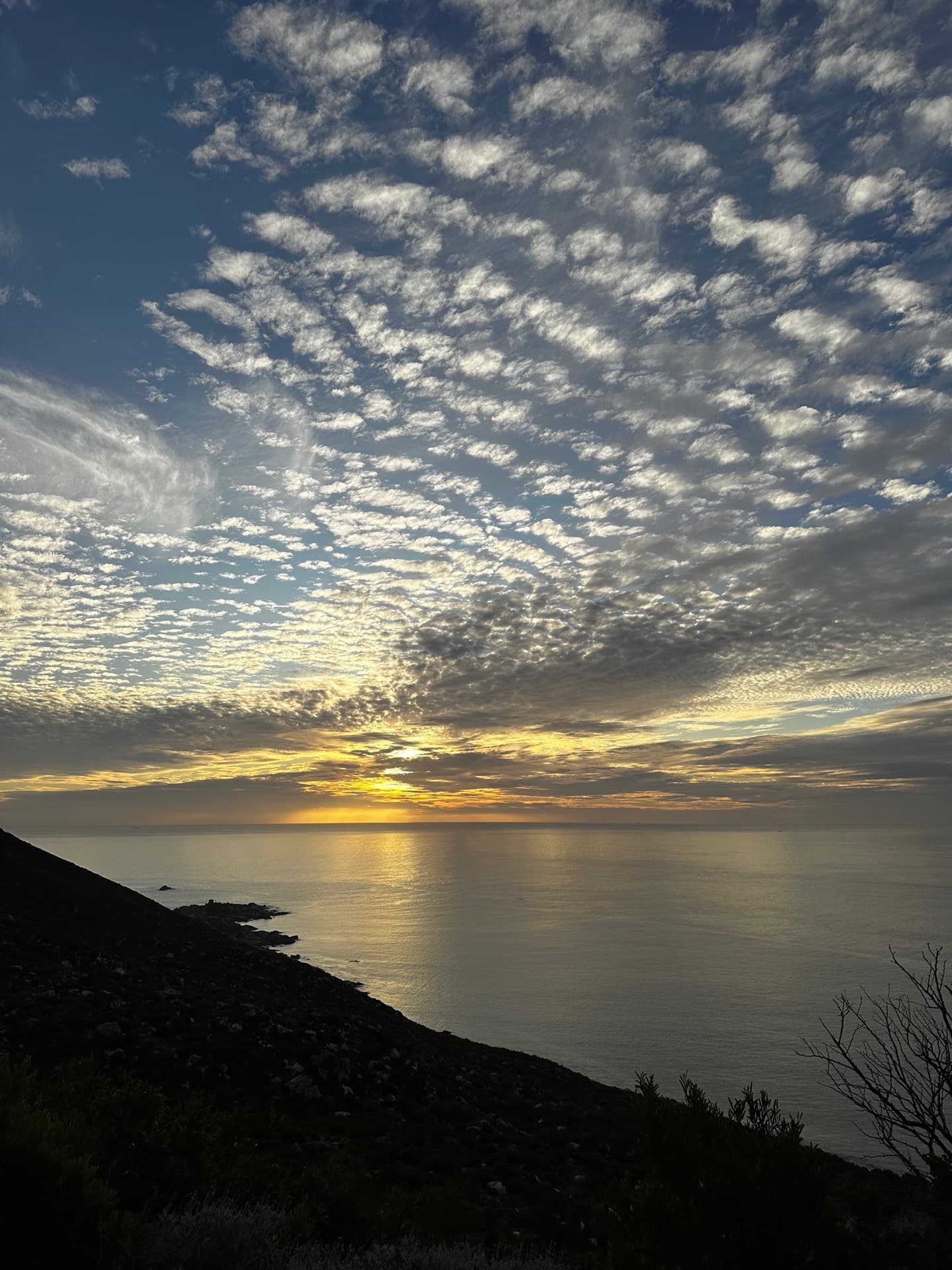 Storm clouds gathering over the sea at golden hour